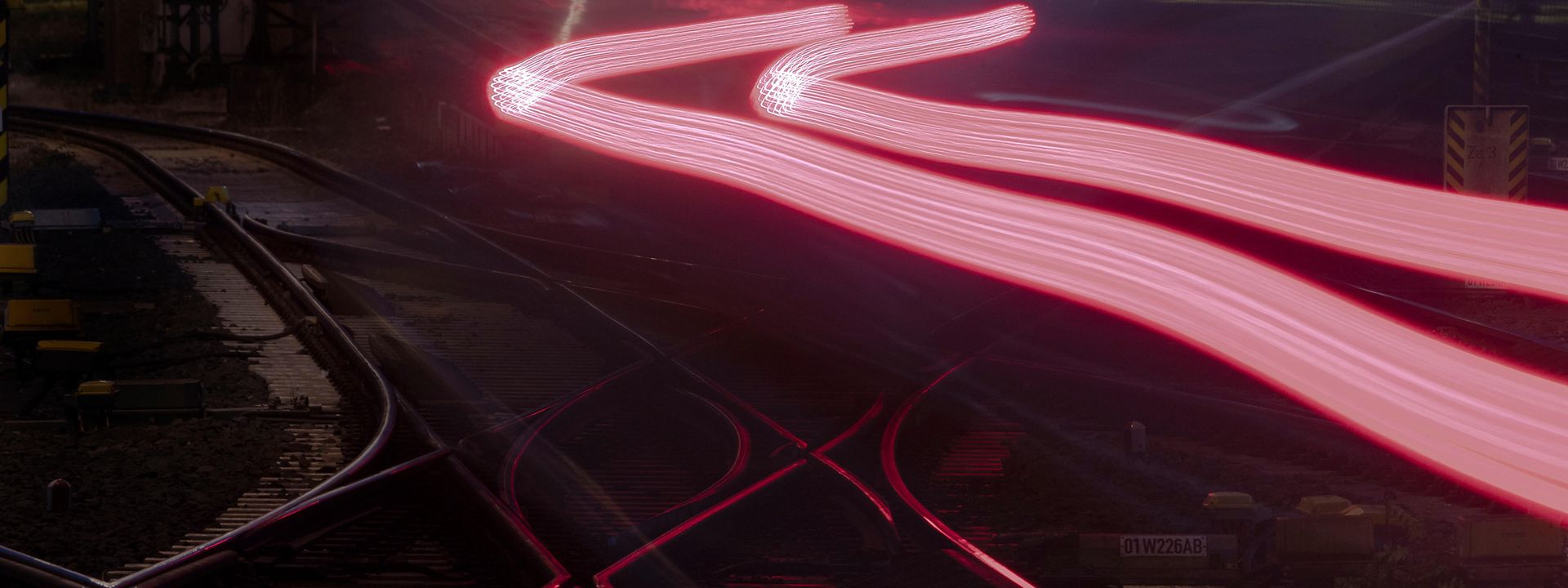 Train tracks at night enlightened red 